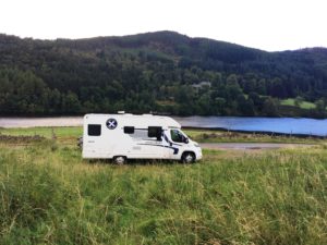 wild camping with your rental motorohme enjoying the view by the loch